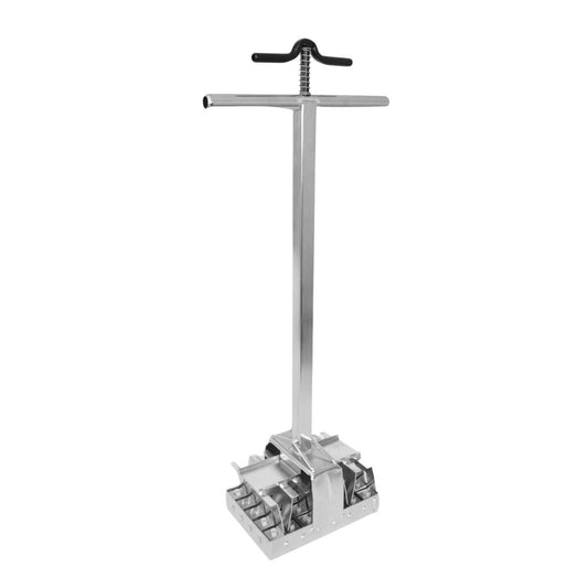 Product shot of a metallic pipe clamp featuring a vertical post, a horizontal handle, and a square base with multiple gripping components.
