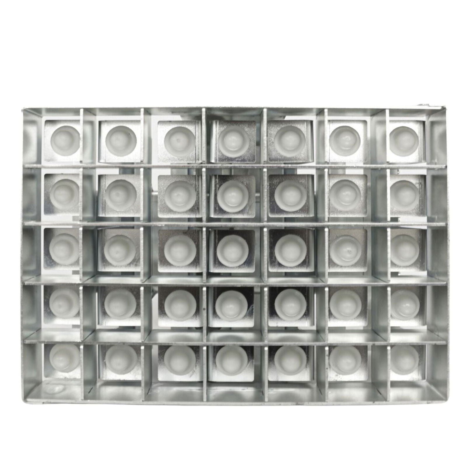 Metal grid with thirty-six small off-white circular inserts against a white background showing a repetitive pattern of geometric shapes