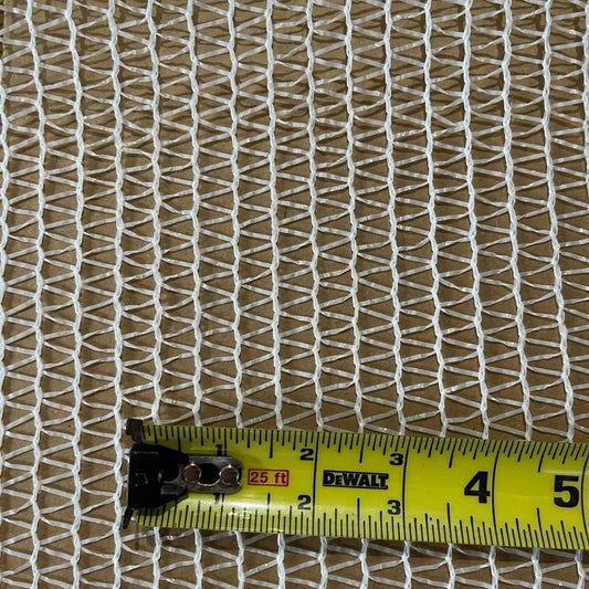 A close-up image shows the Bootstrap Farmer Greenhouse Shade Cloth - 30% White, draped over a brown surface with a yellow measuring tape at the bottom, displaying inches from 3 to 5.