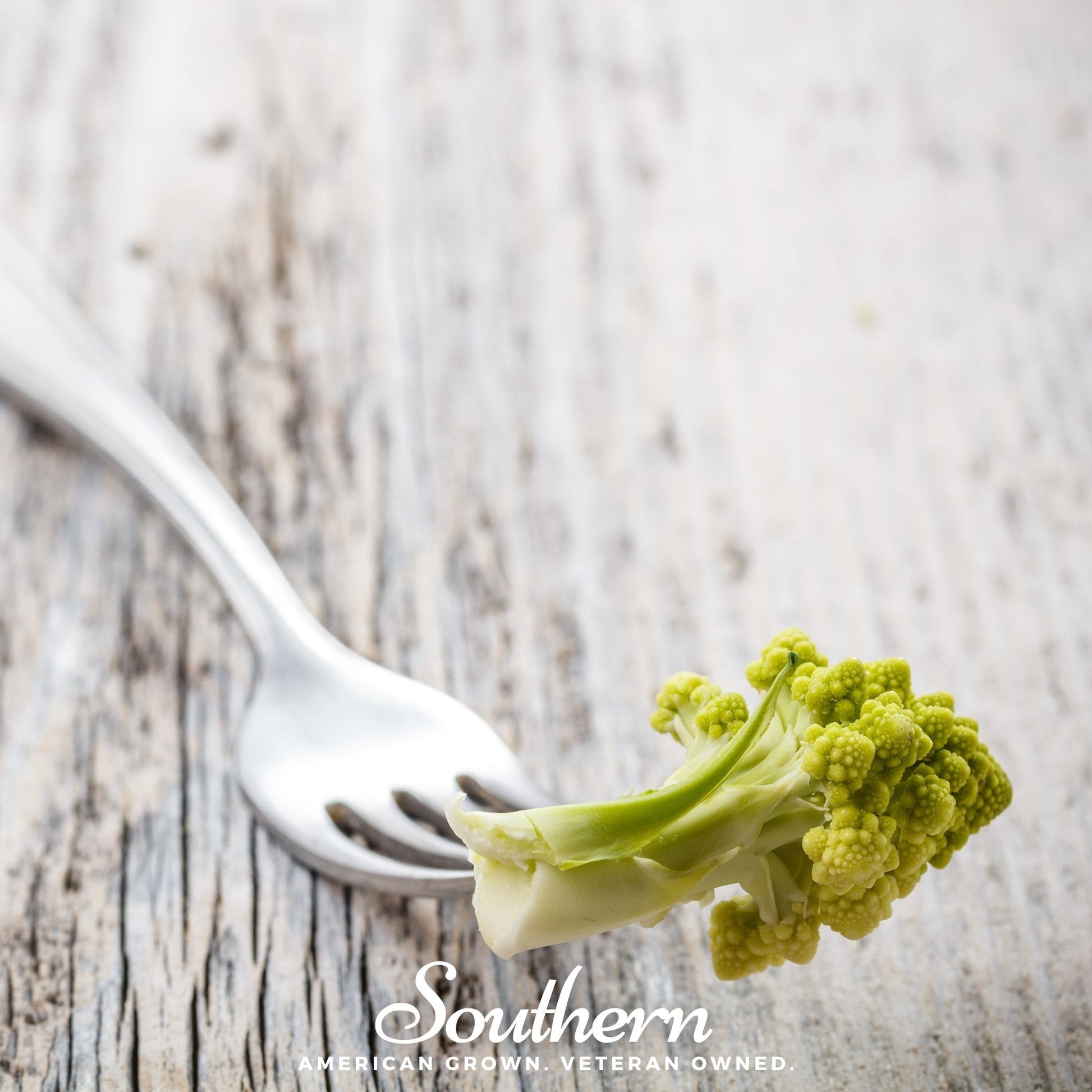 Romanesco broccoli seeds by Southern Seeds, showing vibrant green, spiral-shaped vegetable buds ready for planting.