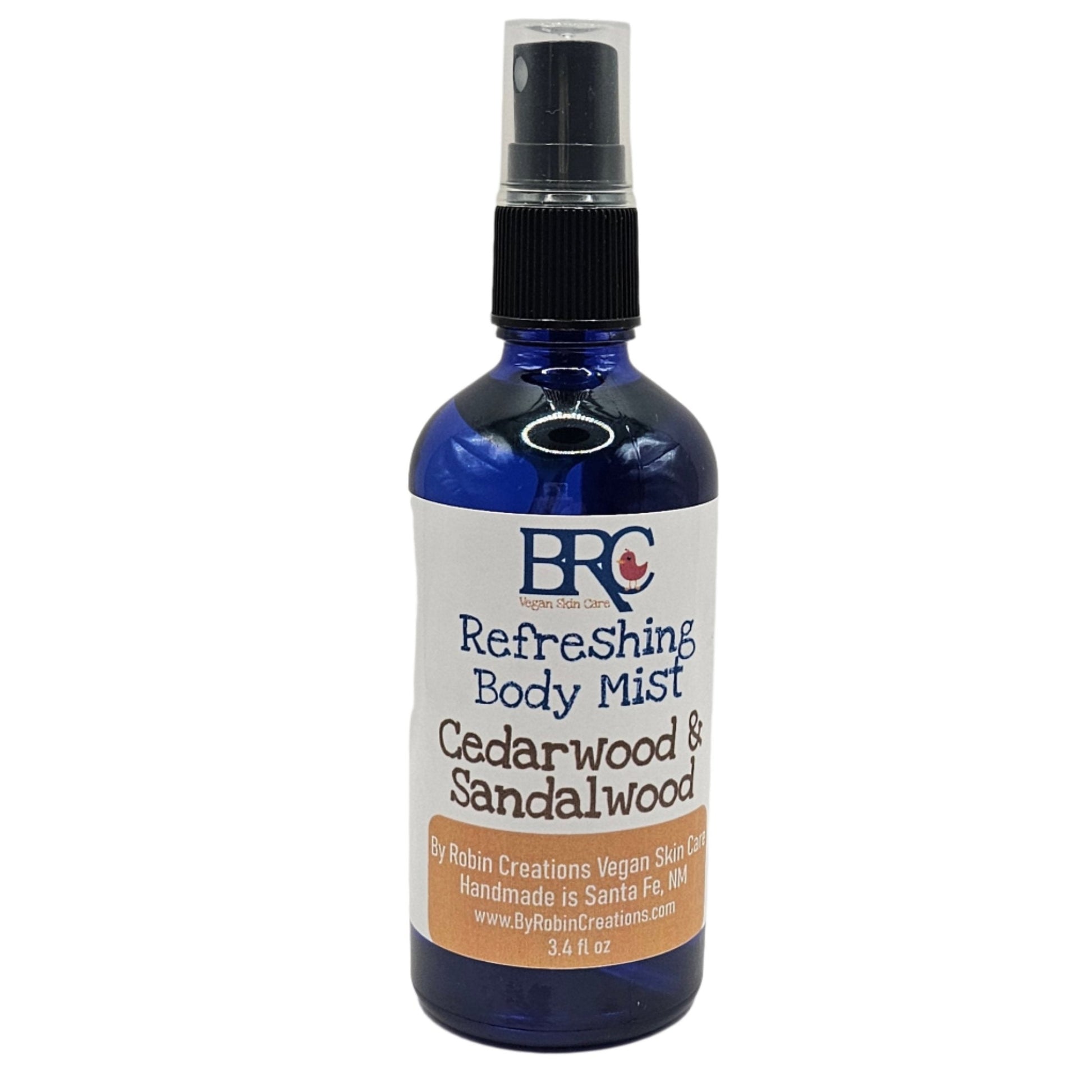 By Robin Creations essential oil body mist in a frosty balsam pine scent, 3.4 oz glass bottle, lightweight and refreshing perfume.