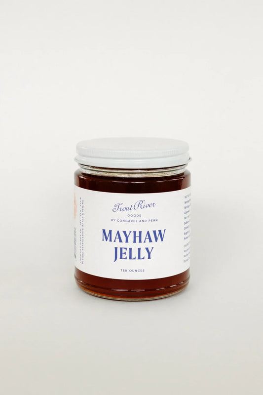 Jar of Congaree and Penn Mayhaw Jelly with a clear label, showcasing a vibrant, glossy fruit spread on a clean background.