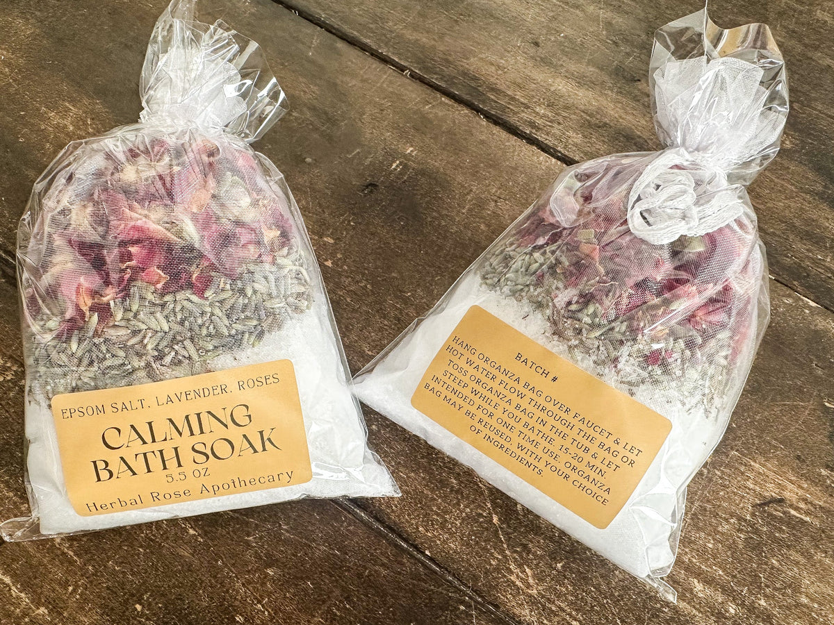 Herbalroseapothecary calming herbal bath soak with natural dried herbs and soothing scents in a clear jar, new label design.