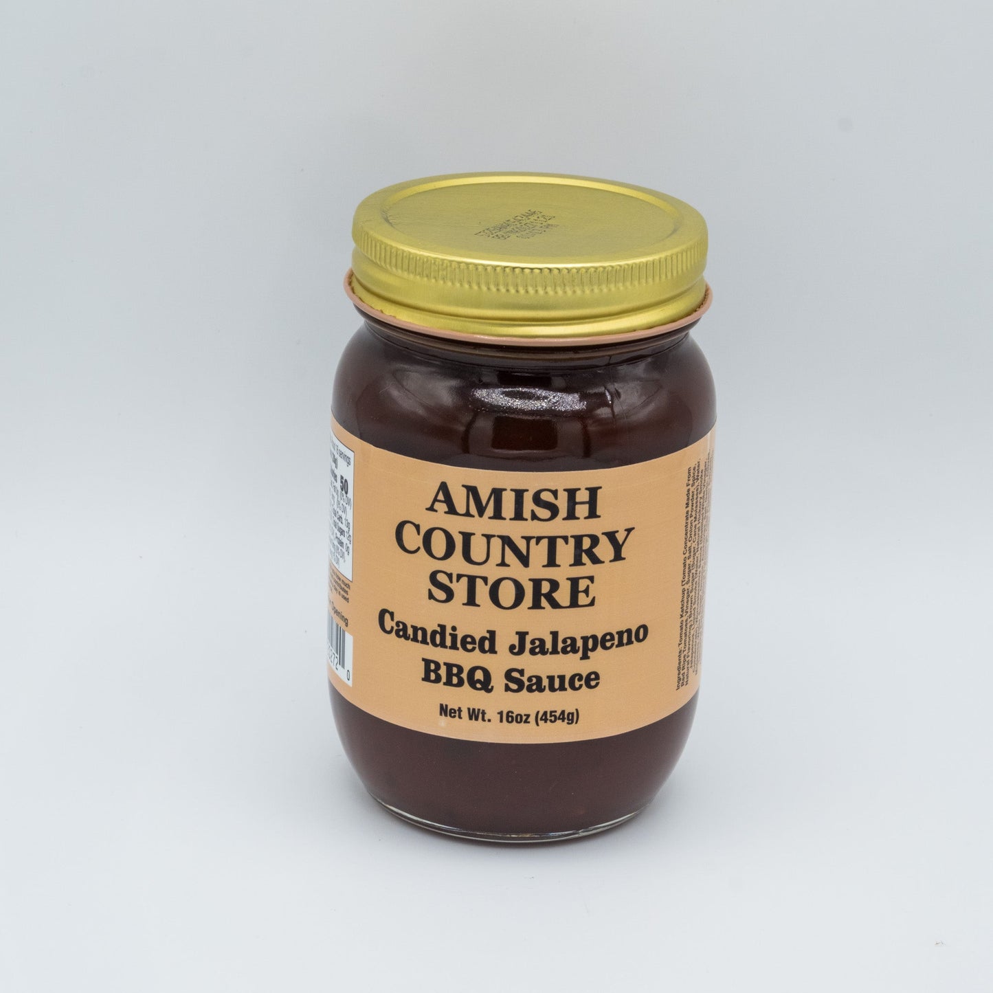Canned Amish Country Store Candied Jalapeno BBQ Sauce bottle with label showing jalapepenos and sweet glaze, 16 oz jar