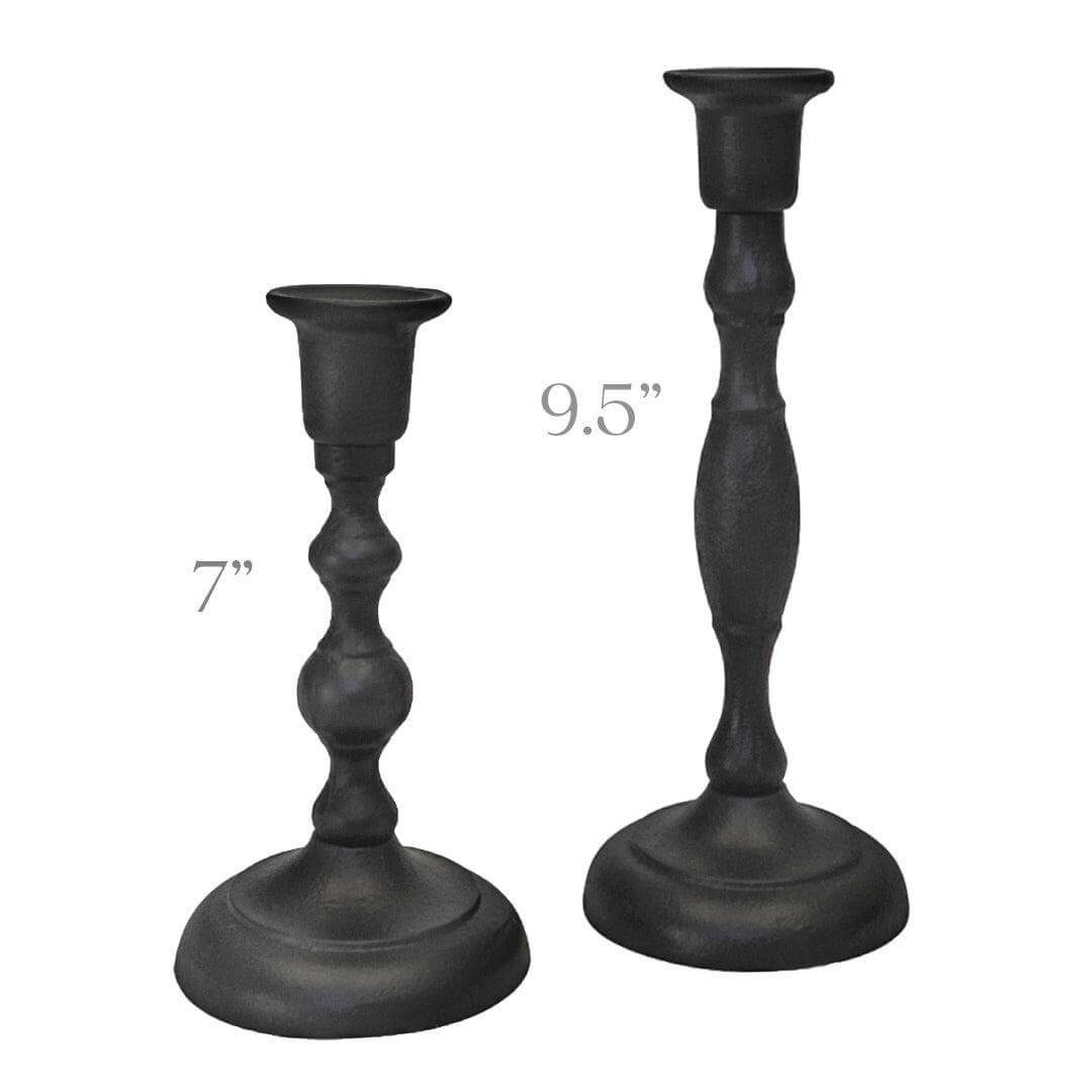 Set of handcrafted cast iron taper candle holders with a rustic finish, designed by Bluecorn Candles for elegant tabletop decor.
