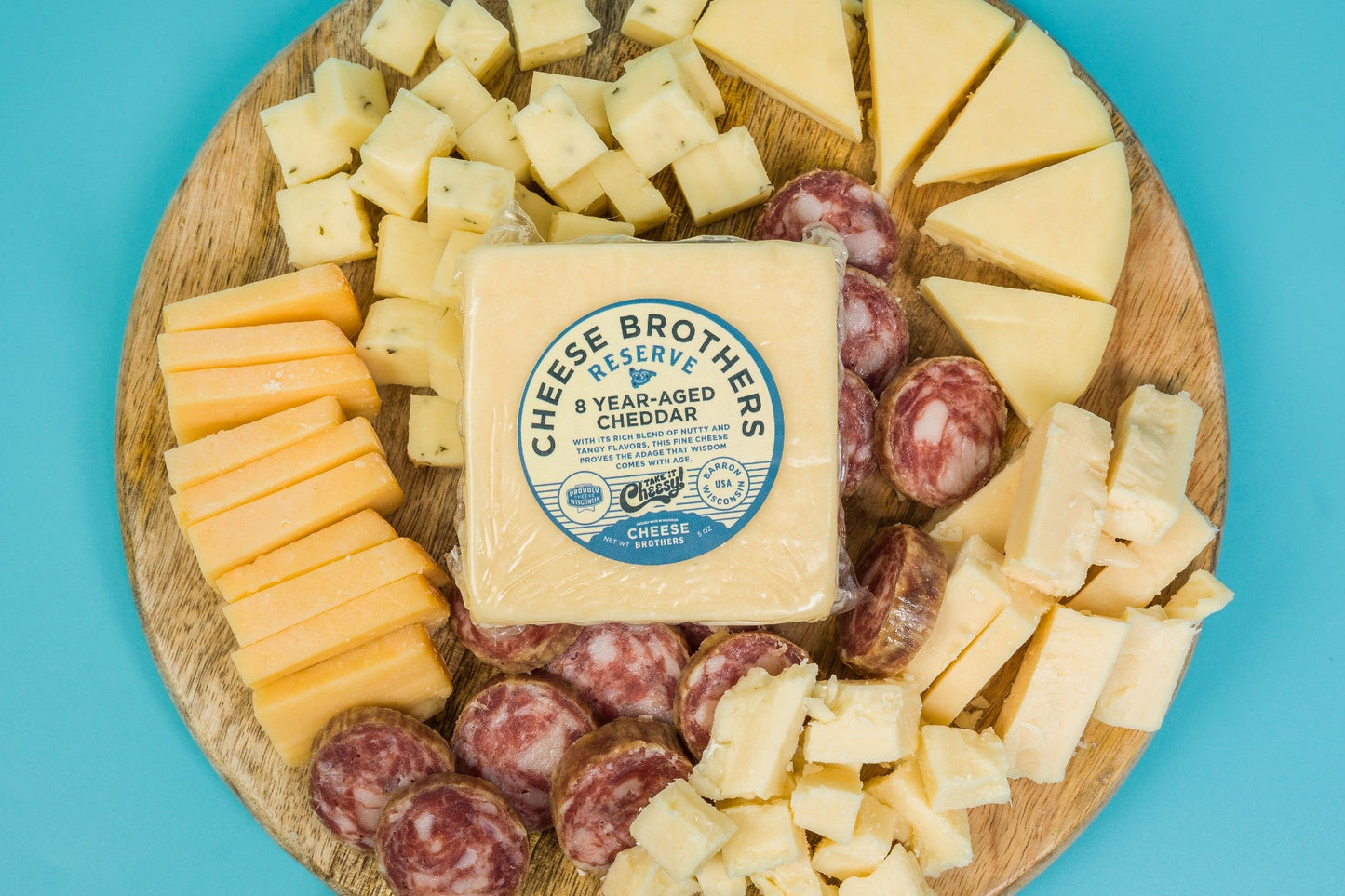 Cheese Brothers Inc. charcuterie gift box with assorted cured meats, cheeses, and accompaniments in a stylish bundle.
