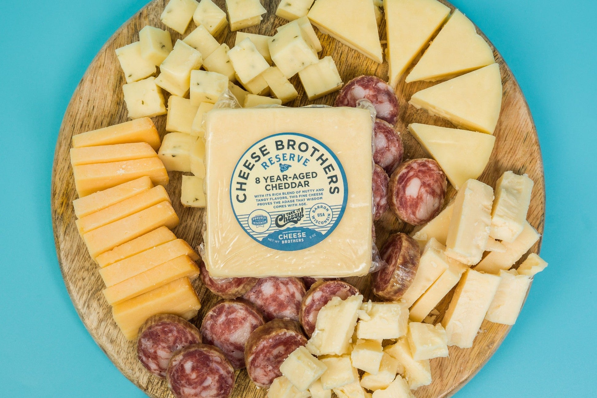 Cheese Brothers Inc. charcuterie gift box with assorted cured meats, cheeses, and accompaniments in a stylish bundle.