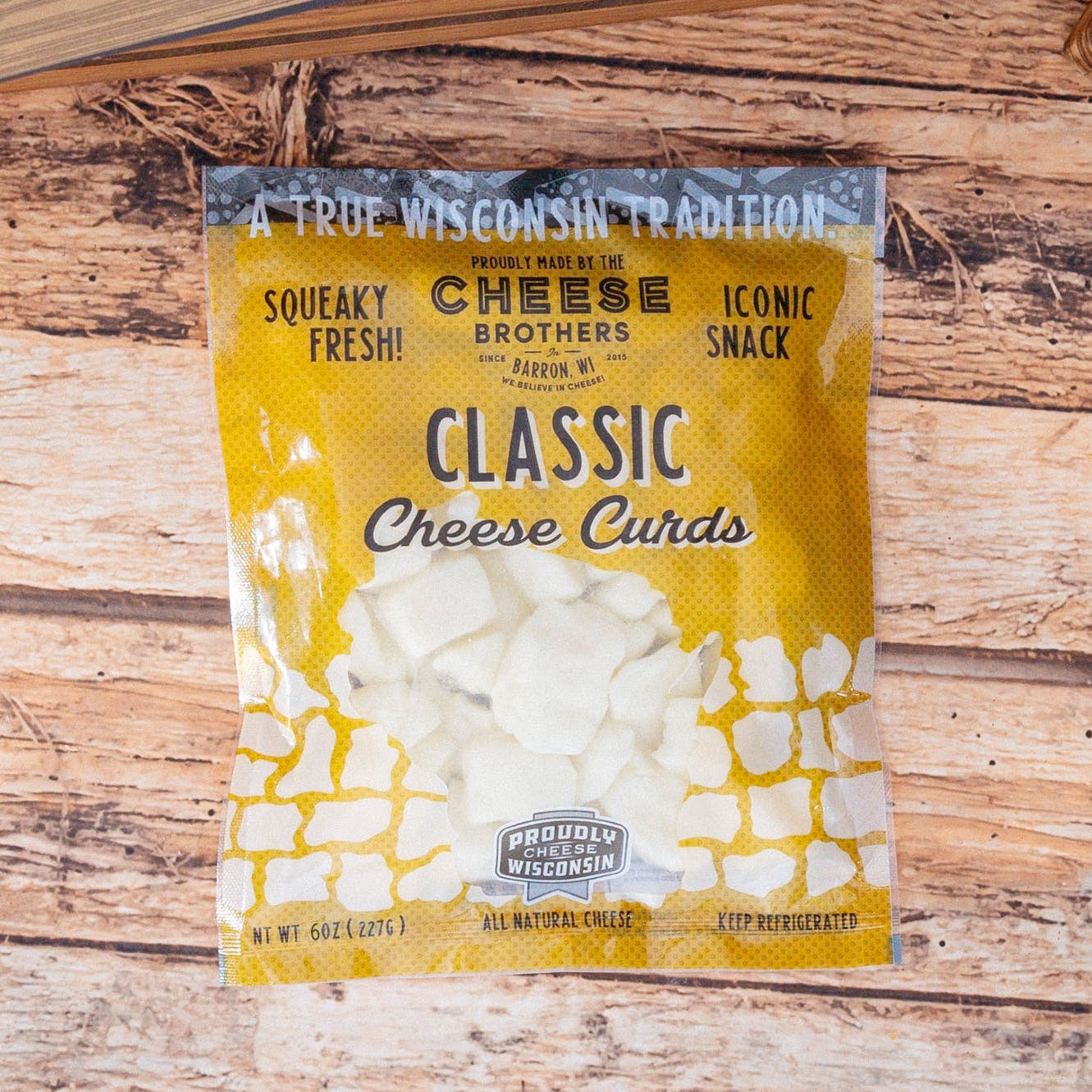 Wisconsin Cheese Brothers, Inc. cheese curds in a pack, fresh daily, showcasing golden, crispy cheese curds ready to enjoy.