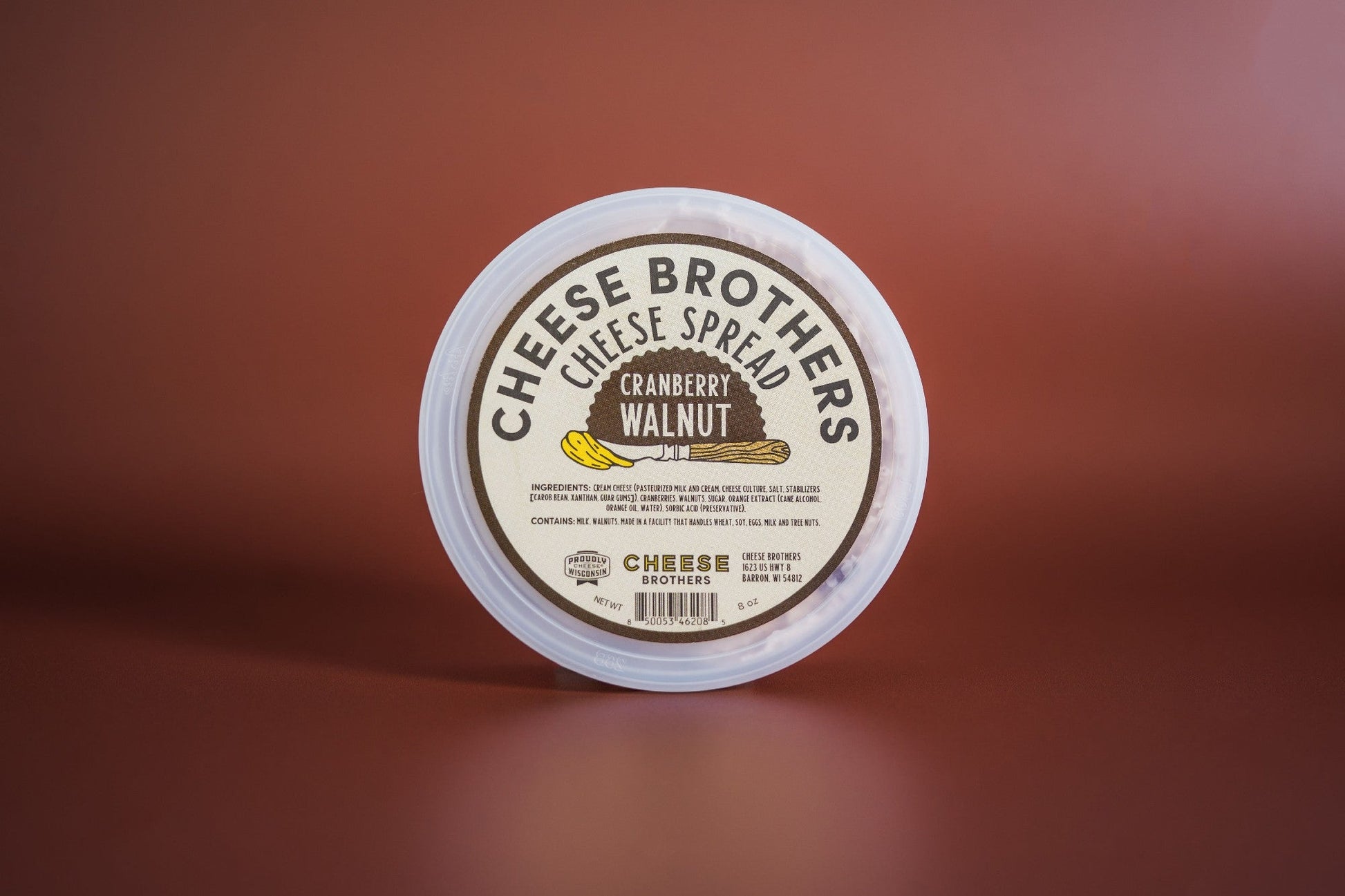 Creamy cranberry walnut cheese spread by Cheese Brothers, Inc., with visible cranberry pieces and walnut chunks in a smooth spread