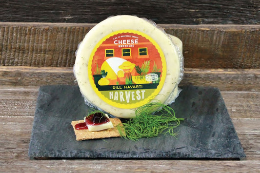 Cheese Brothers Inc. housewarming gift basket with assorted cheeses, snacks, and gourmet treats in a gift bundle.