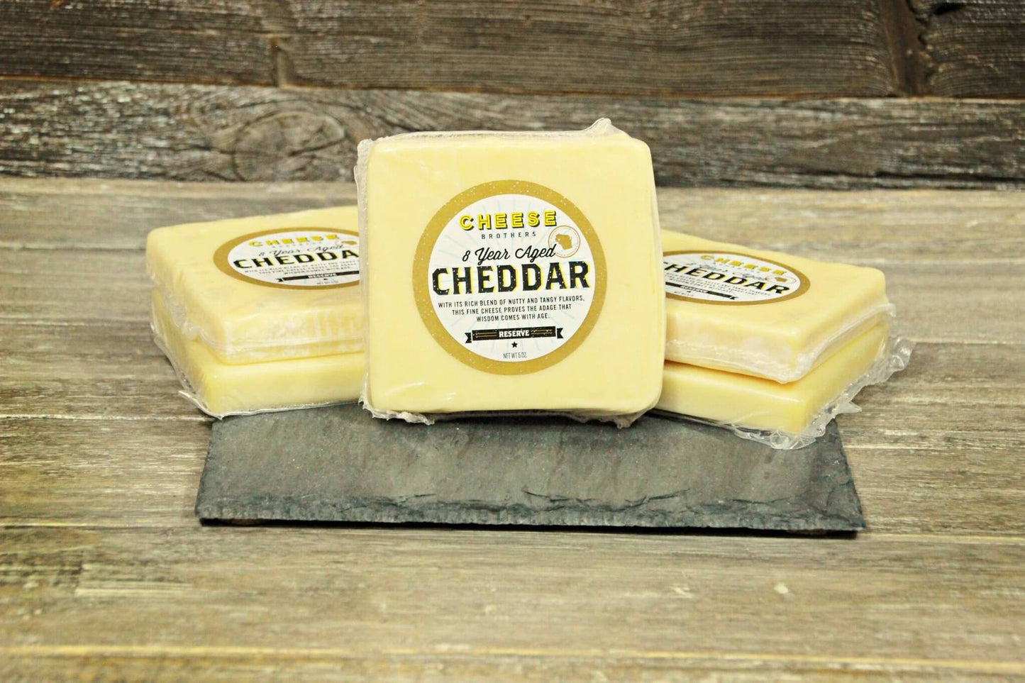 Housewarming gift basket from Cheese Brothers Inc. with assorted cheeses, crackers, and gourmet treats in a stylish gift bundle.