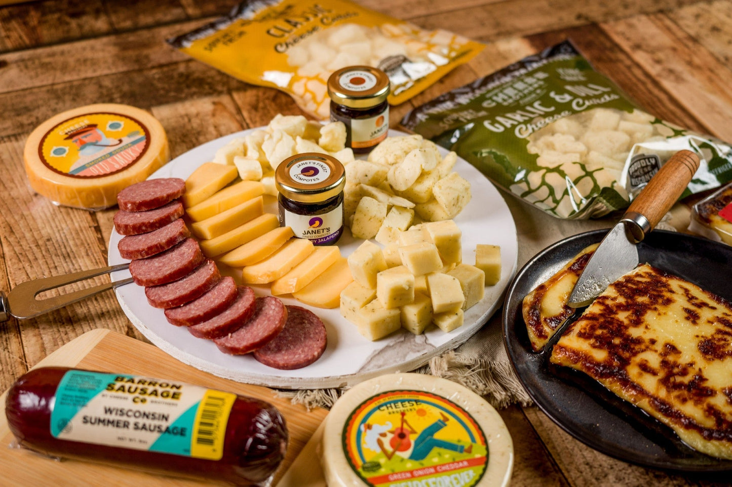 Cheese Brothers Inc. Just About Everything Box with assorted cheeses, snacks, and gourmet treats in a gift bundle.