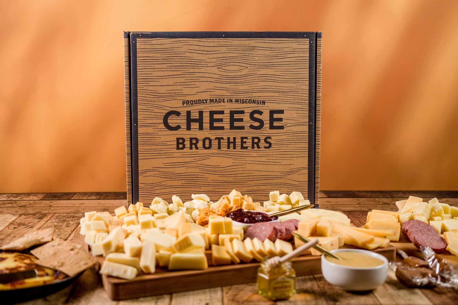 Cheese Brothers, Inc. Just About Everything Box gift bundle featuring assorted cheeses and snacks in a decorative box.