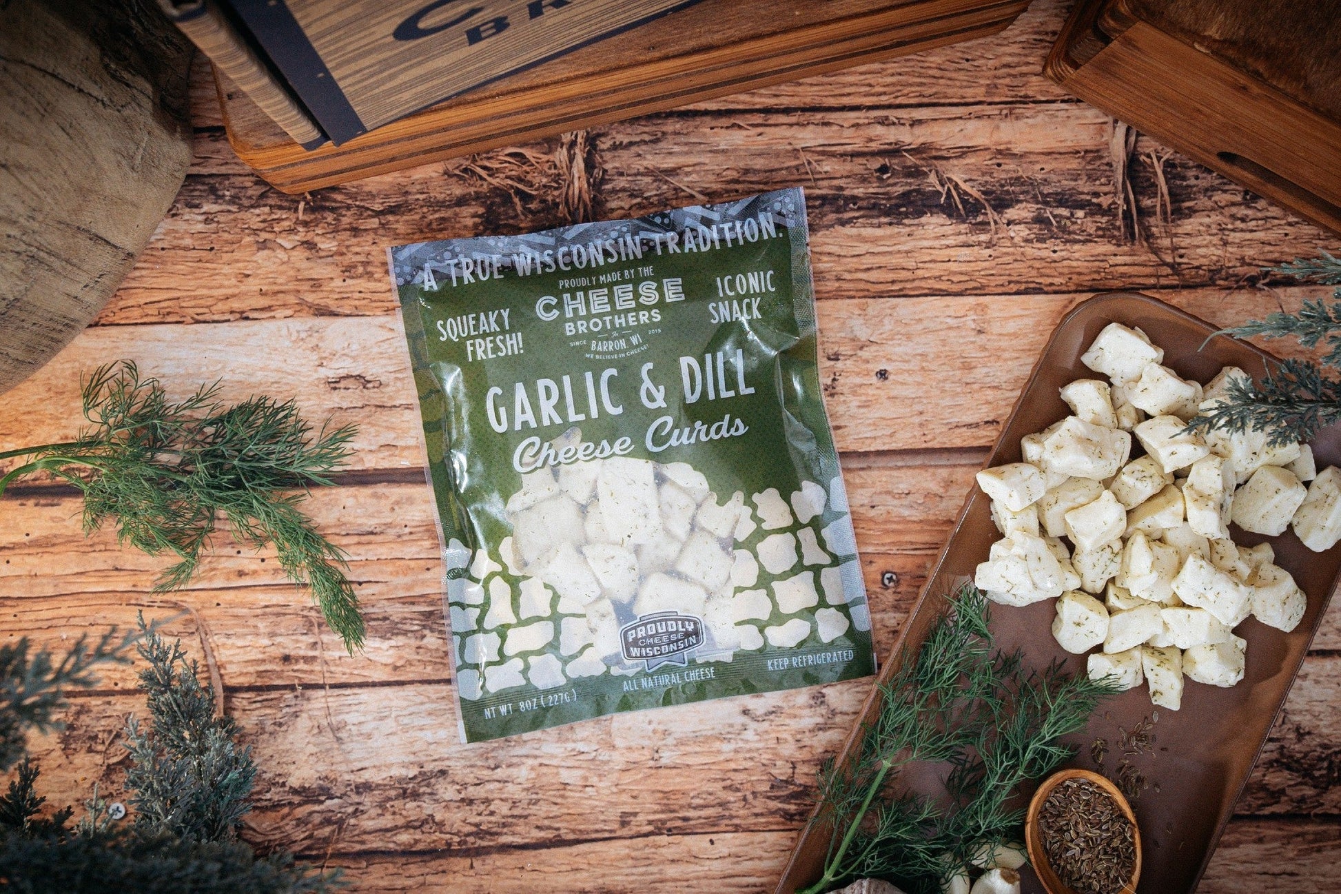 Cheese Brothers Inc. The Char-CURD-erie Box gift set featuring assorted cheeses and curated accompaniments in a decorative box