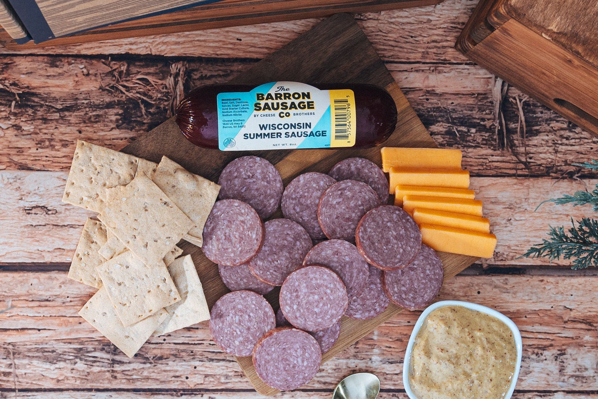 Cheese Brothers Inc. Char-CURD-erie Box featuring assorted cheeses and curated gift items in a stylish bundle.