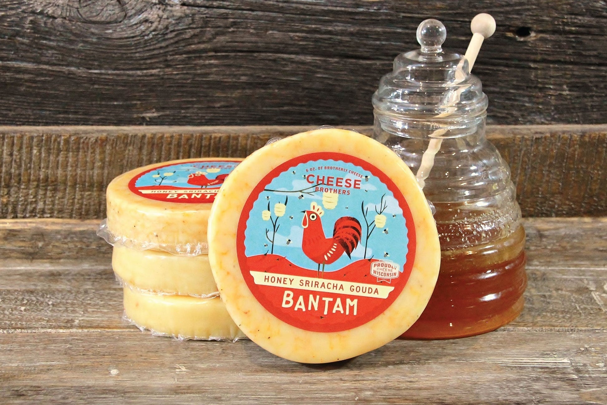 Creamy Honey Sriracha Gouda cheese from Cheese Brothers, Inc., with a smooth texture and spicy honey flavor.