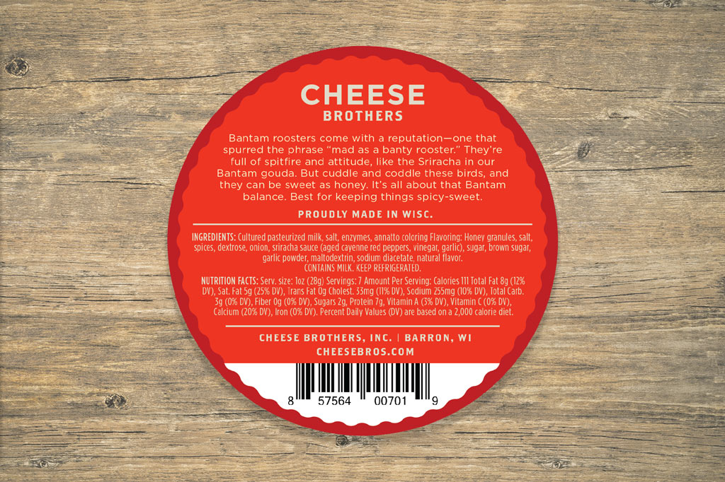Honey Sriracha Gouda cheese by Cheese Brothers, Inc., showing a wedge of flavorful honey-sriracha Gouda cheese on a wooden board.