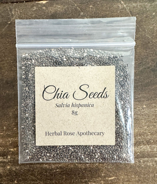 Dried chia seeds from HerbalRoseApothecary in a small 8g package, showing tiny, oval, light brown seeds.