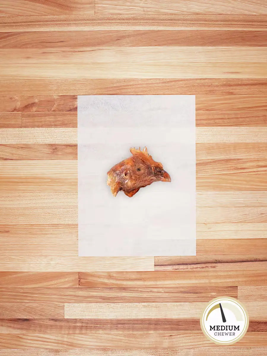 Farm Hounds chicken head chew for dogs, showing a natural, dried chicken head used as an eco-friendly pet treat.