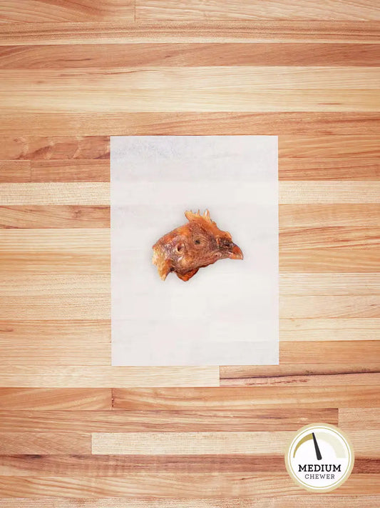 Farm Hounds chicken head chew for dogs, showing a natural, dried chicken head used as an eco-friendly pet treat.