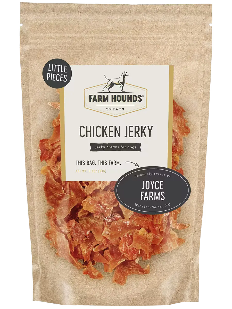 Farm Hounds chicken jerky with small, dried chicken pieces, showing the textured, natural look of the jerky in a close-up image.
