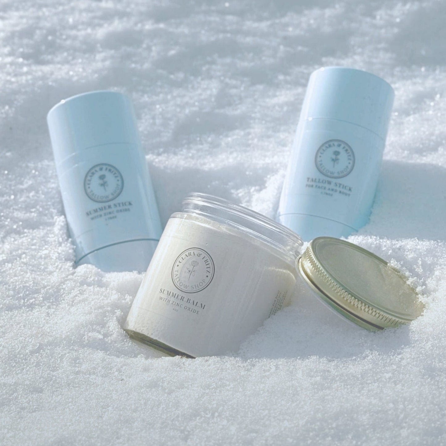 Clara & Fritz Tallow Shop Summer Balm for Body with Zinc Oxide in a 4oz lotion bottle, moisturizing and soothing skin.