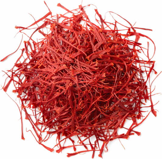 Closeup of fiery red Super Negin grade saffron threads in a small pile, showcasing premium Vanilla Bean Kings saffron quality.