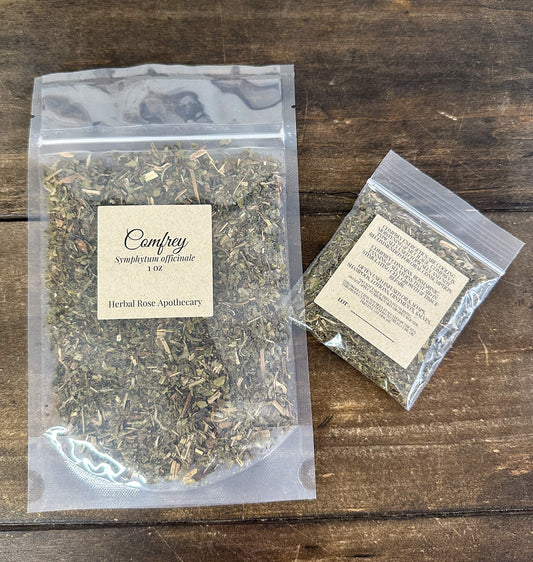 Dried comfrey herbs from HerbalRoseApothecary, showing leafy, dried plant material in a natural state for herbal use.