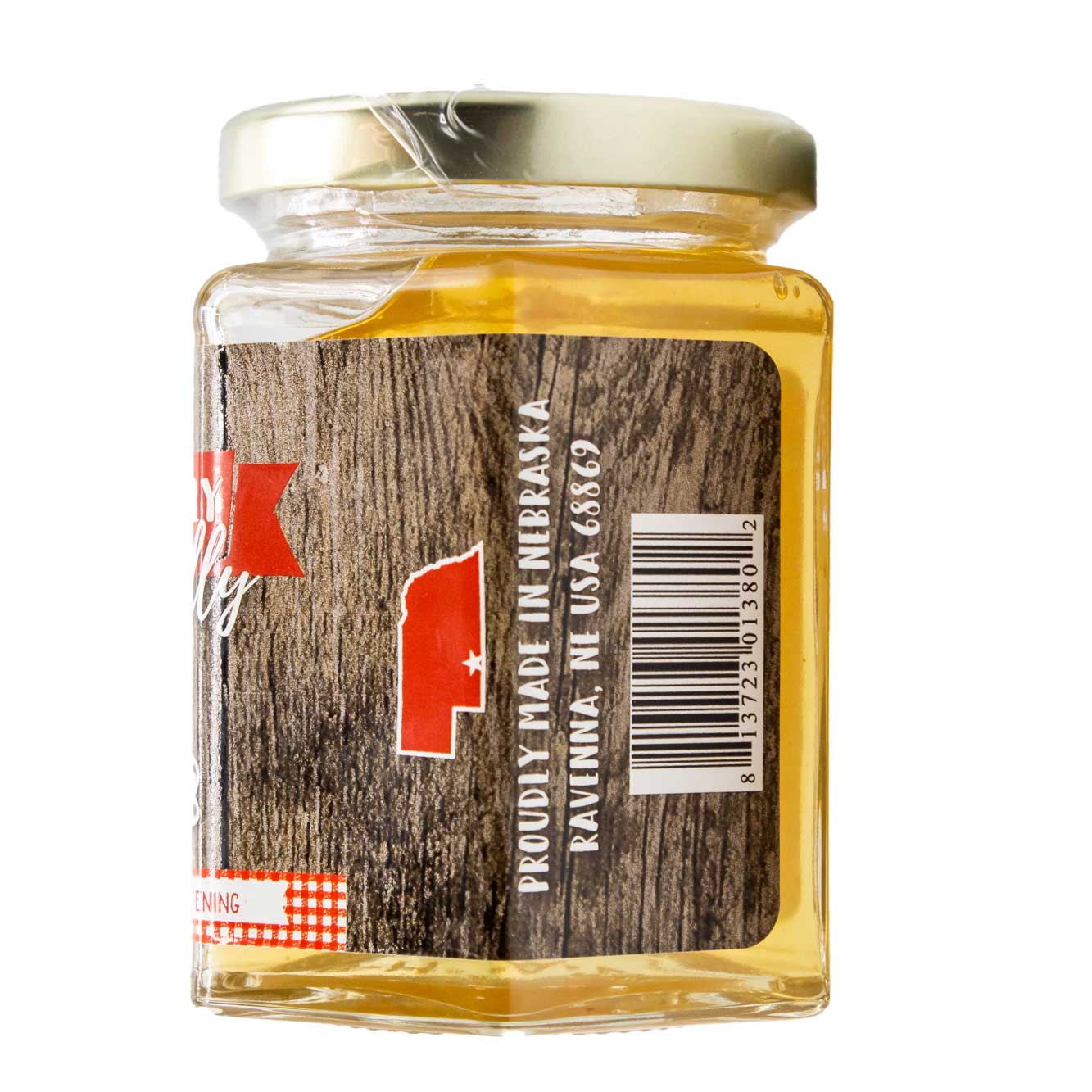 Sweet corn cob jelly jar from Nutt Family Jams, showing a clear glass container filled with golden corn-flavored jelly.