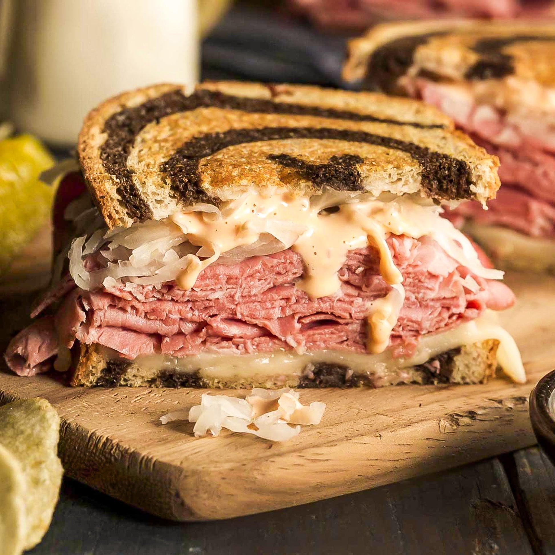 Corned beef Reuben sandwich kit by Pig of the Month BBQ, featuring rye bread, corned beef, sauerkraut, and Swiss cheese.