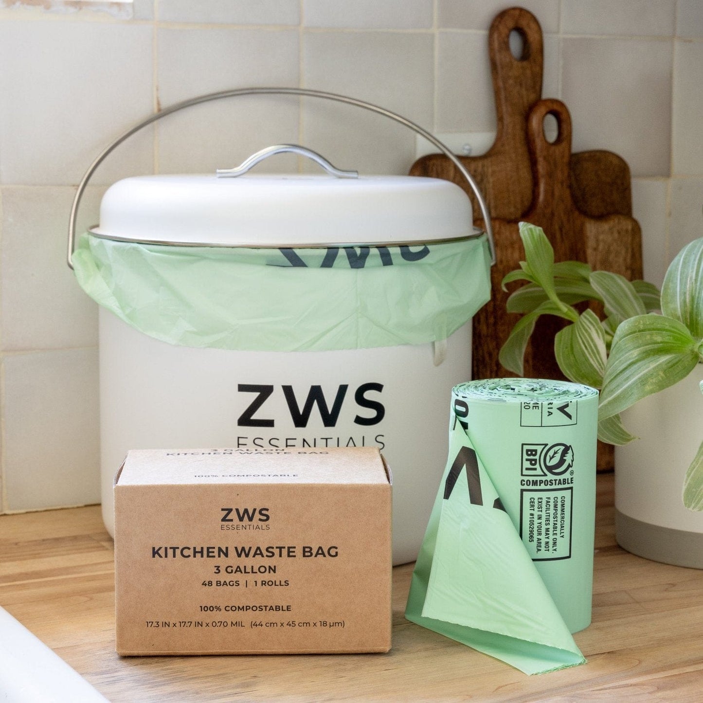 White countertop compost bin from ZeroWasteStore.com, compact kitchen compost container with lid for easy waste collection.
