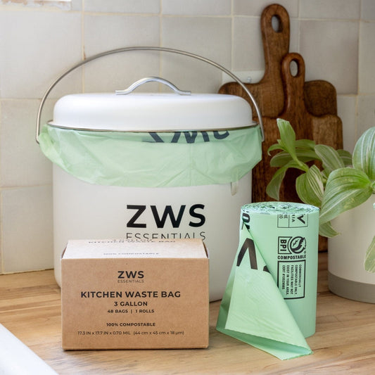 White countertop compost bin from ZeroWasteStore.com, compact kitchen compost container with lid for easy waste collection.