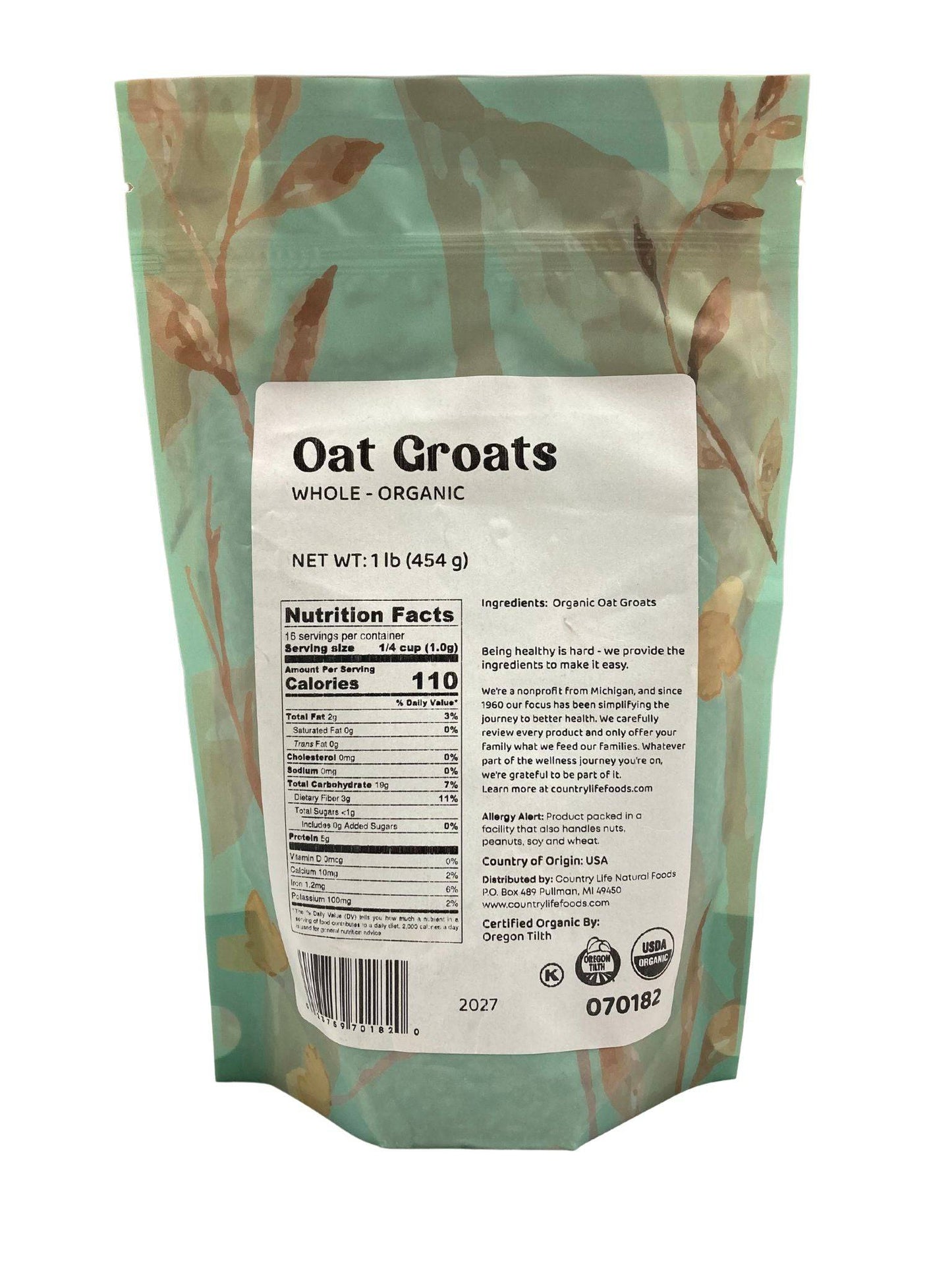 A light green resealable bag from Country Life Natural Foods labeled Oat Groats, Whole, Organic, net weight 1 lb (454 g). The back shows nutrition facts and ingredients for this high fiber product. Leaf patterns decorate the packaging.