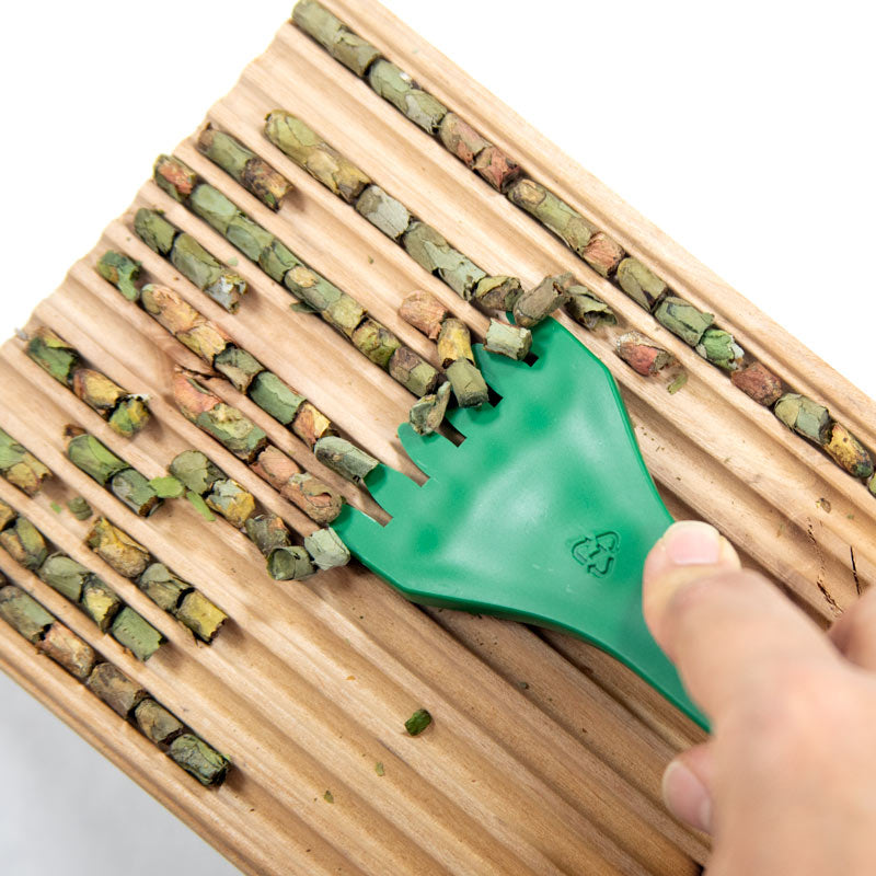 CrownBees Cocoon Harvesting Comb for beekeepers, with wooden handle and fine prongs for efficient cocoon collection.