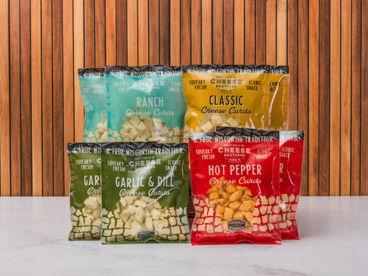 Wisconsin Cheese Brothers Inc. cheese curds sampler with 8 fresh, golden cheese curds in a gift bundle, ready to enjoy.