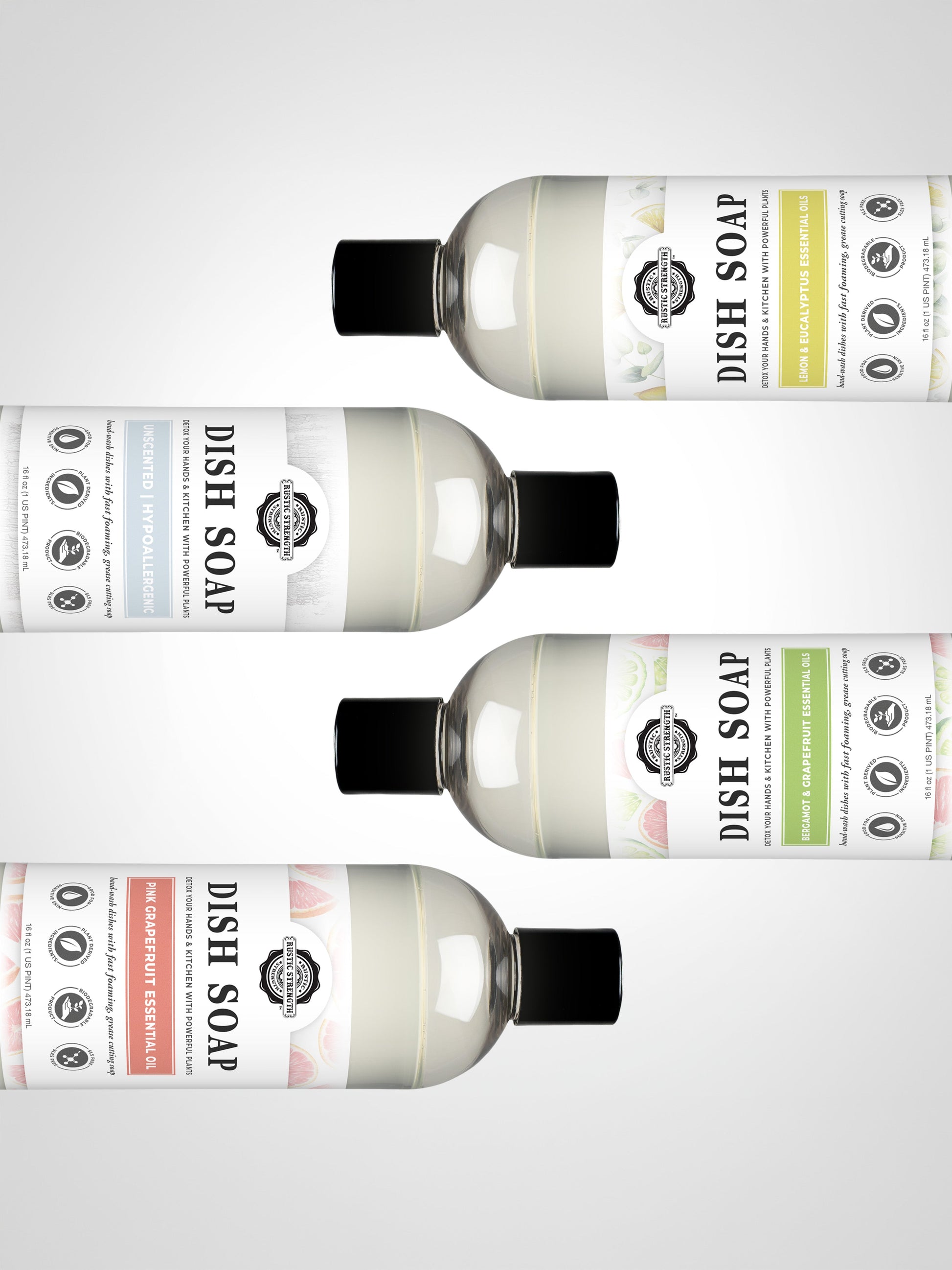Four bottles of Rustic Strength Dish Soap | Pink Grapefruit are arranged horizontally on a white background, each featuring a different colored label—blue, yellow, green, and red—with icons and pink grapefruit branding visible.