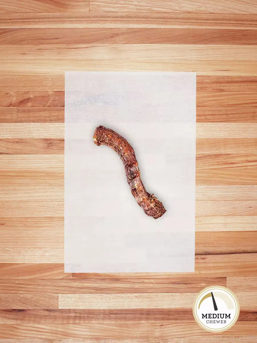 Skinless Duck Neck chew from Farm Hounds, showing a natural, fresh duck neck chew for dogs with visible meat and bone texture.