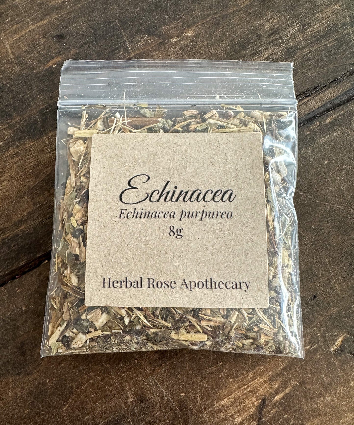 Dried Echinacea herb from HerbalRoseApothecary, 8g package, showing vibrant purple Echinacea flowers and dried herb leaves.