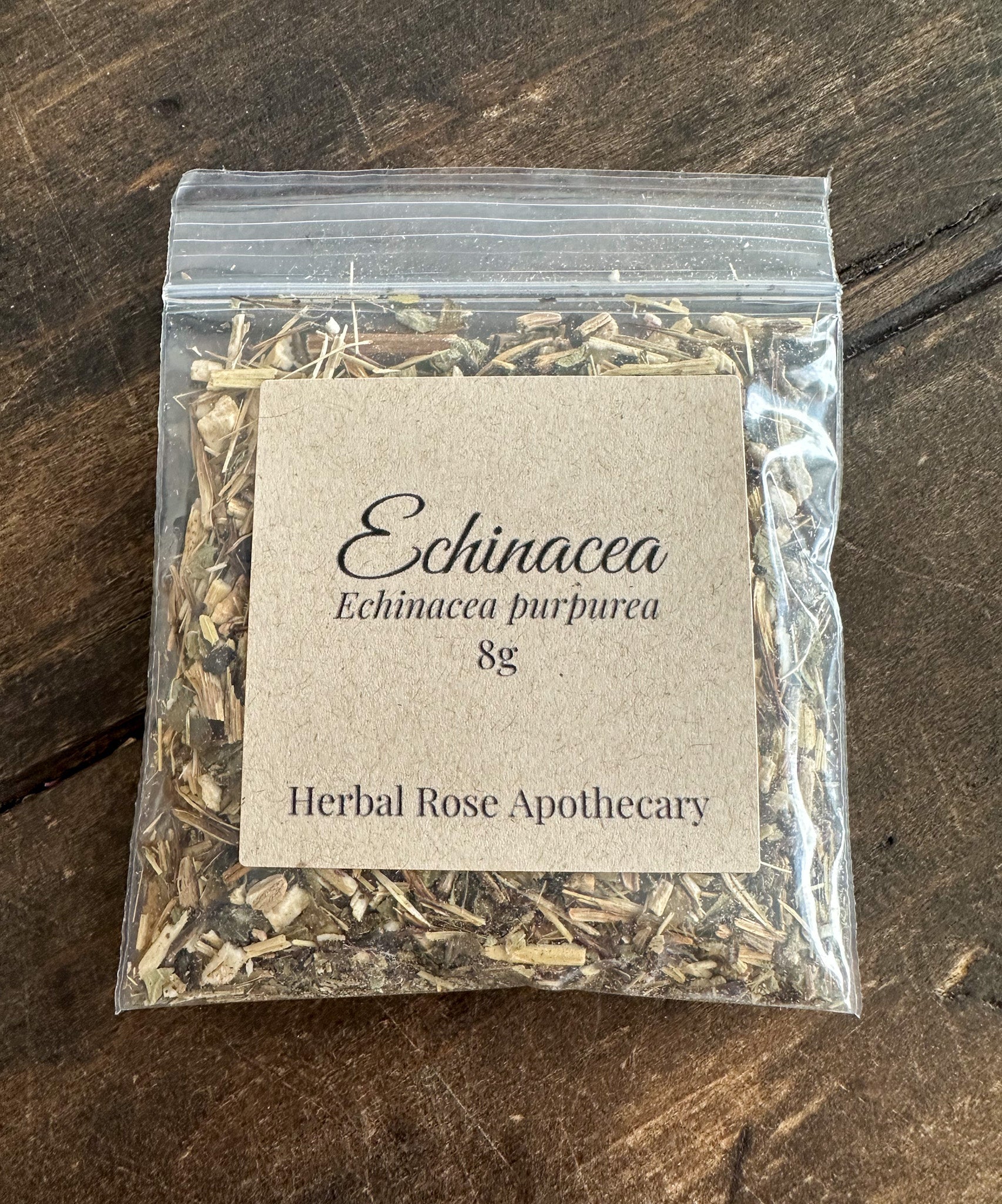 Dried Echinacea herb from HerbalRoseApothecary, 8g package, showing vibrant purple Echinacea flowers and dried herb leaves.