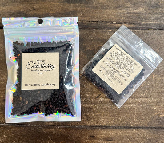 Dried organic elderberries from herbalroseapothecary, close-up of dark purple berries in a natural herb package.