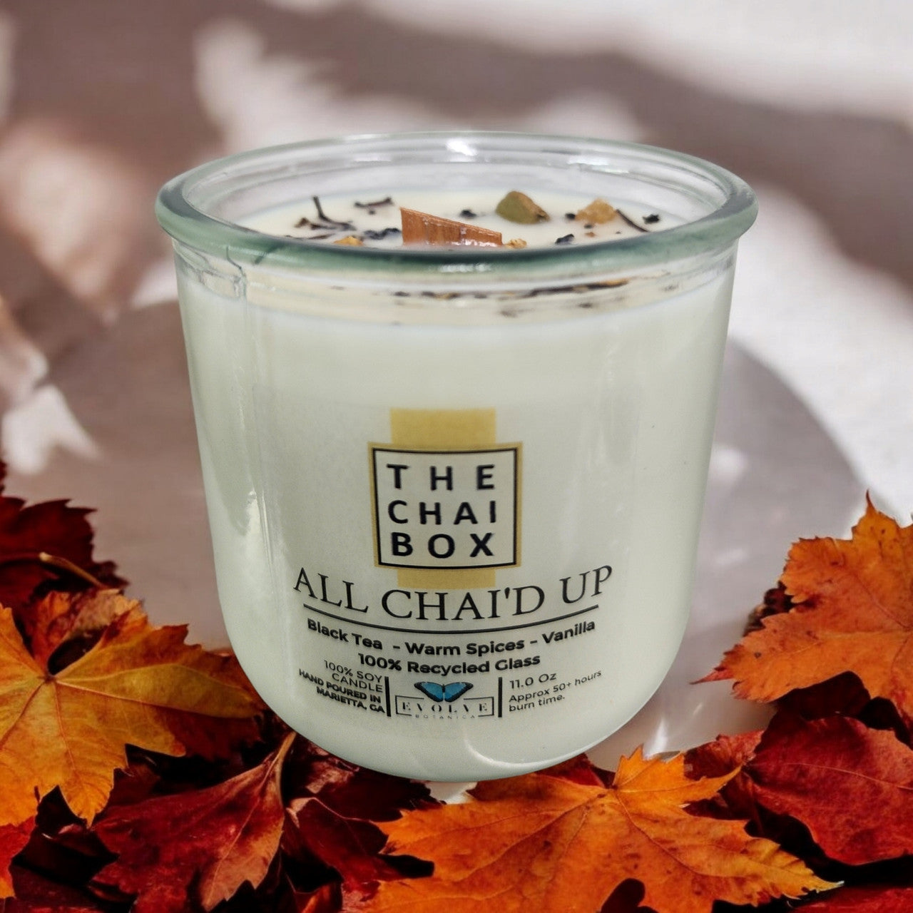Evolve Botanica Rocks Candle Chai with wood wick and gemstone, soy wax, showcasing a warm, calming decorative candle.