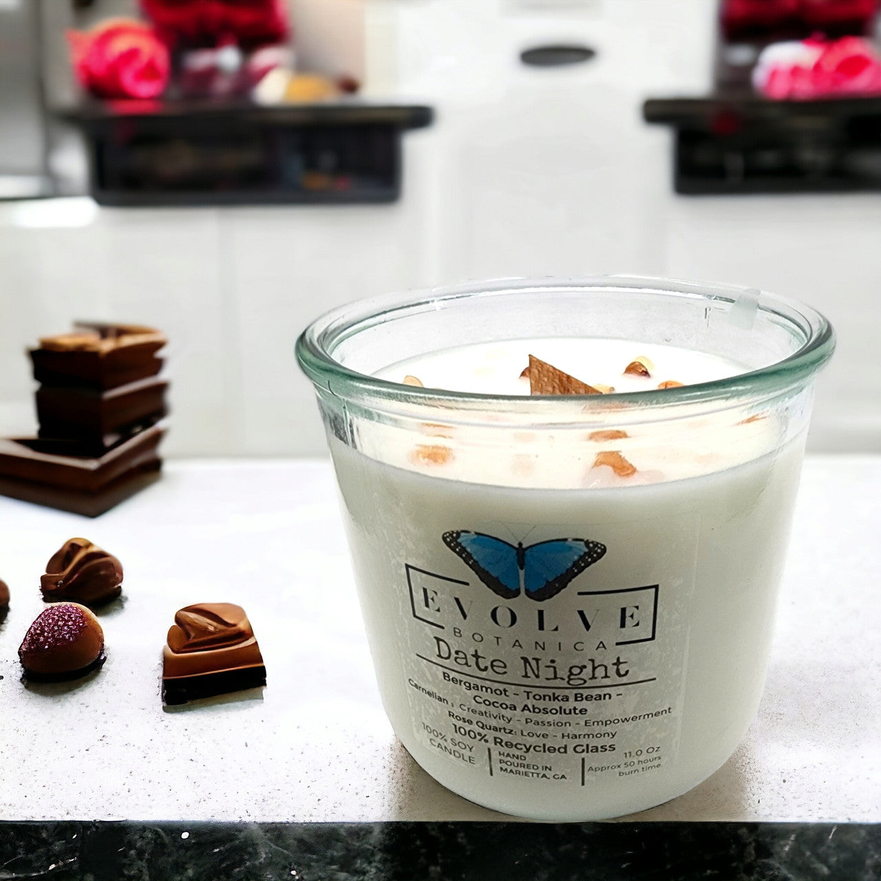 Evolve Botanica Rocks Candle Date Night featuring a wood wick, rose quartz, and carnelian gemstones in a soy candle.