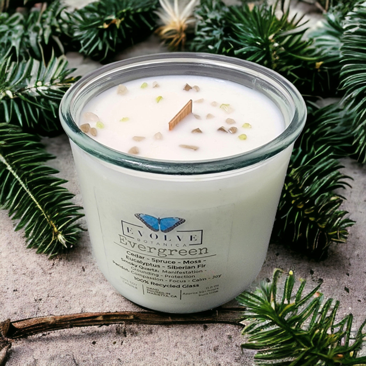 Evergreen Rocks Candle by Evolve Botanica with wood wick, Peridot and Smoky Quartz gemstones, soy wax, decorative and fragrant.