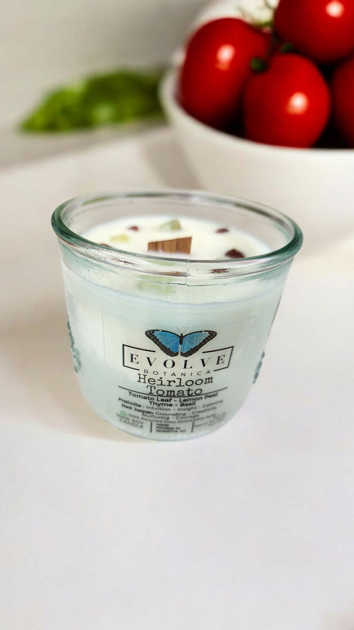Evolve Botanica Rocks Candle with heirloom tomato scent, wood wick, prehnite, red jasper, soy wax, in a decorative jar.