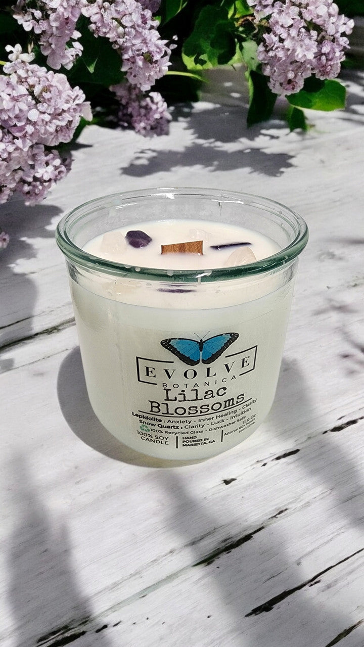 Evolve Botanica Rocks Candle Lilac Blossoms with wood wick, featuring a Lepidolite gemstone and soy wax, scented floral candle.