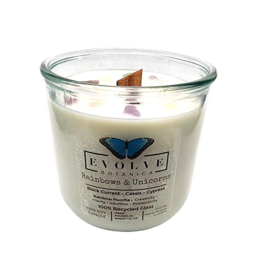 Evolve Botanica Rocks Candle featuring rainbows, unicorns, rainbow fluorite gemstone, soy wax, and a wood wick for a cozy glow.