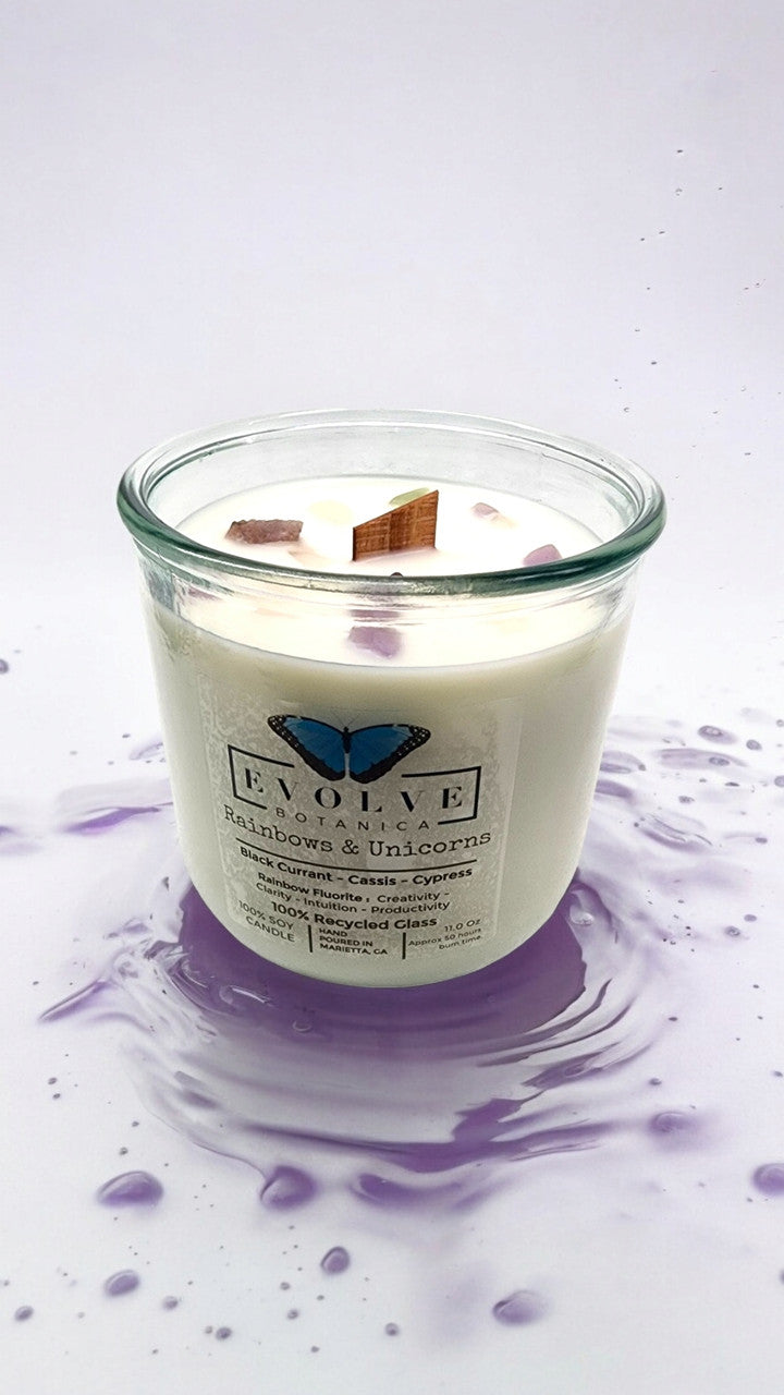 Evolve Botanica Rainbows & Unicorns soy candle with rainbow fluorite gemstone and wood wick, decorative and aromatic candle.