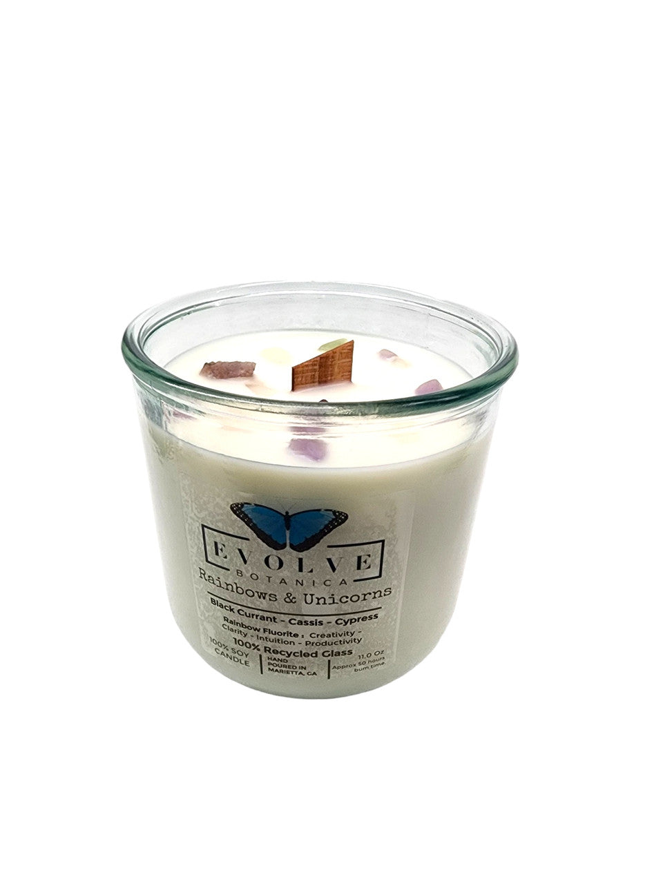 Evolve Botanica Rainbows & Unicorns soy candle with rainbow fluorite gemstone and wood wick, featuring colorful unicorn and rainbow design.