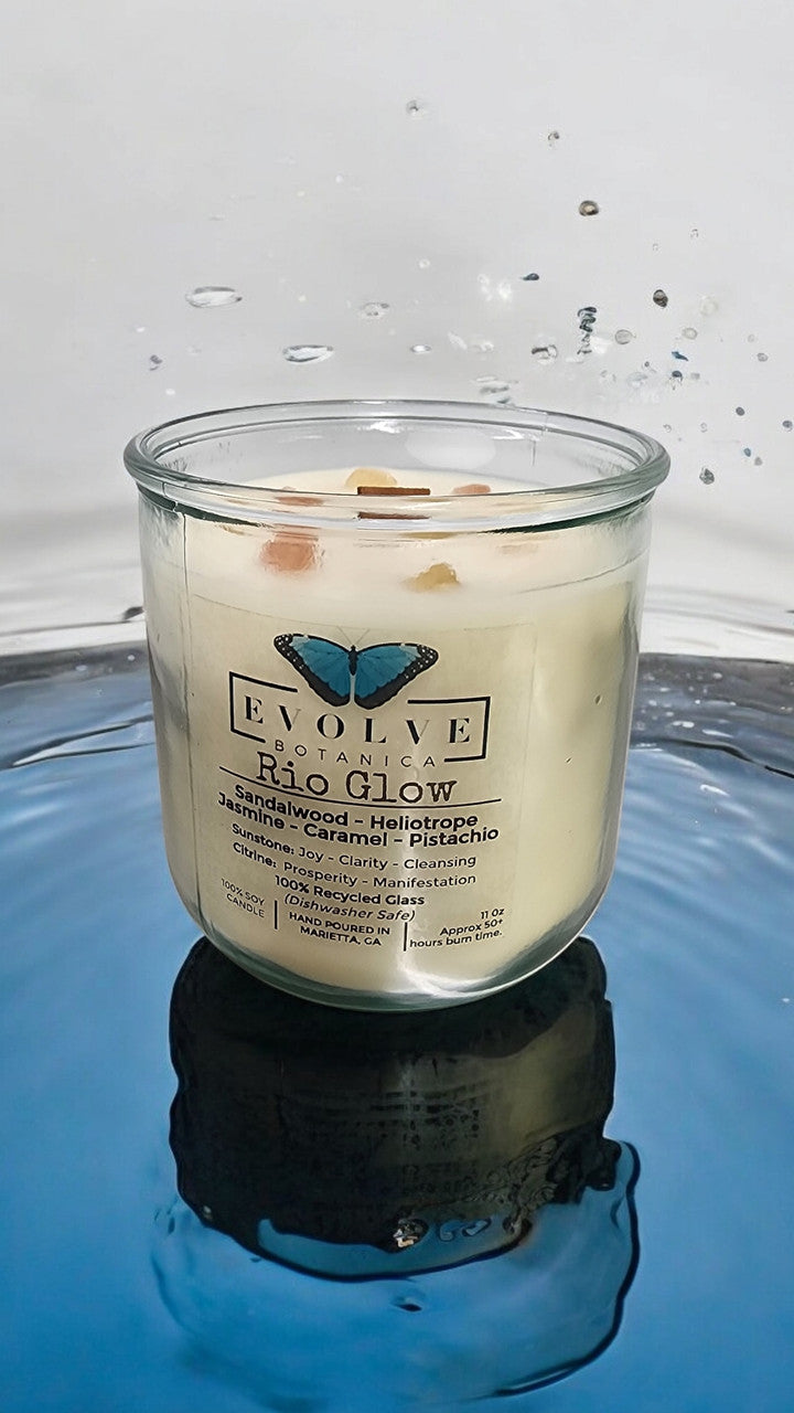 Evolve Botanica Rocks Candle Rio Glow with wood wick, sunstone and citrine gemstones, soy wax, and calming flame.