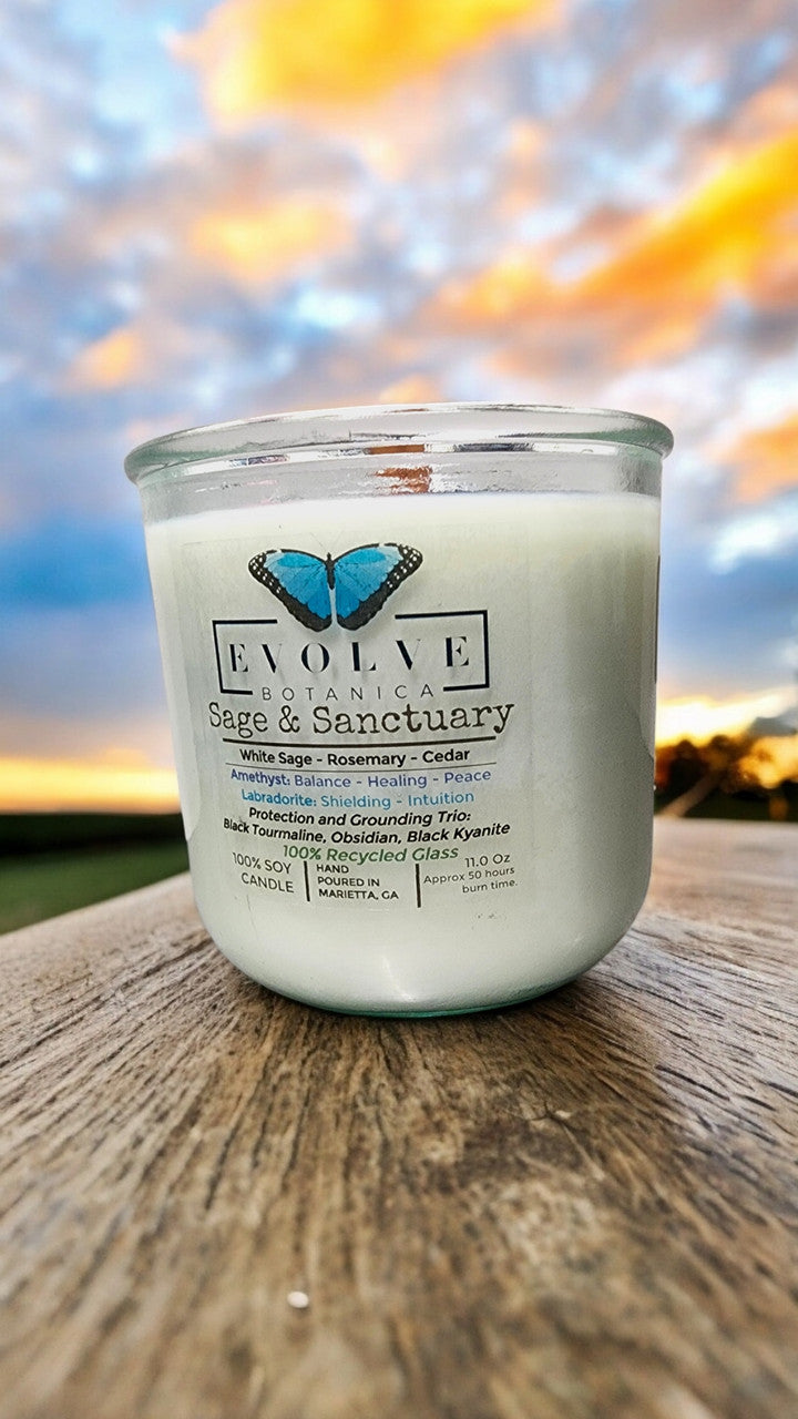 Evolve Botanica Rocks Candle Sage & Sanctuary with Black Kyanite, Tourmaline, Obsidian, Amethyst, and Labradorite crystals.